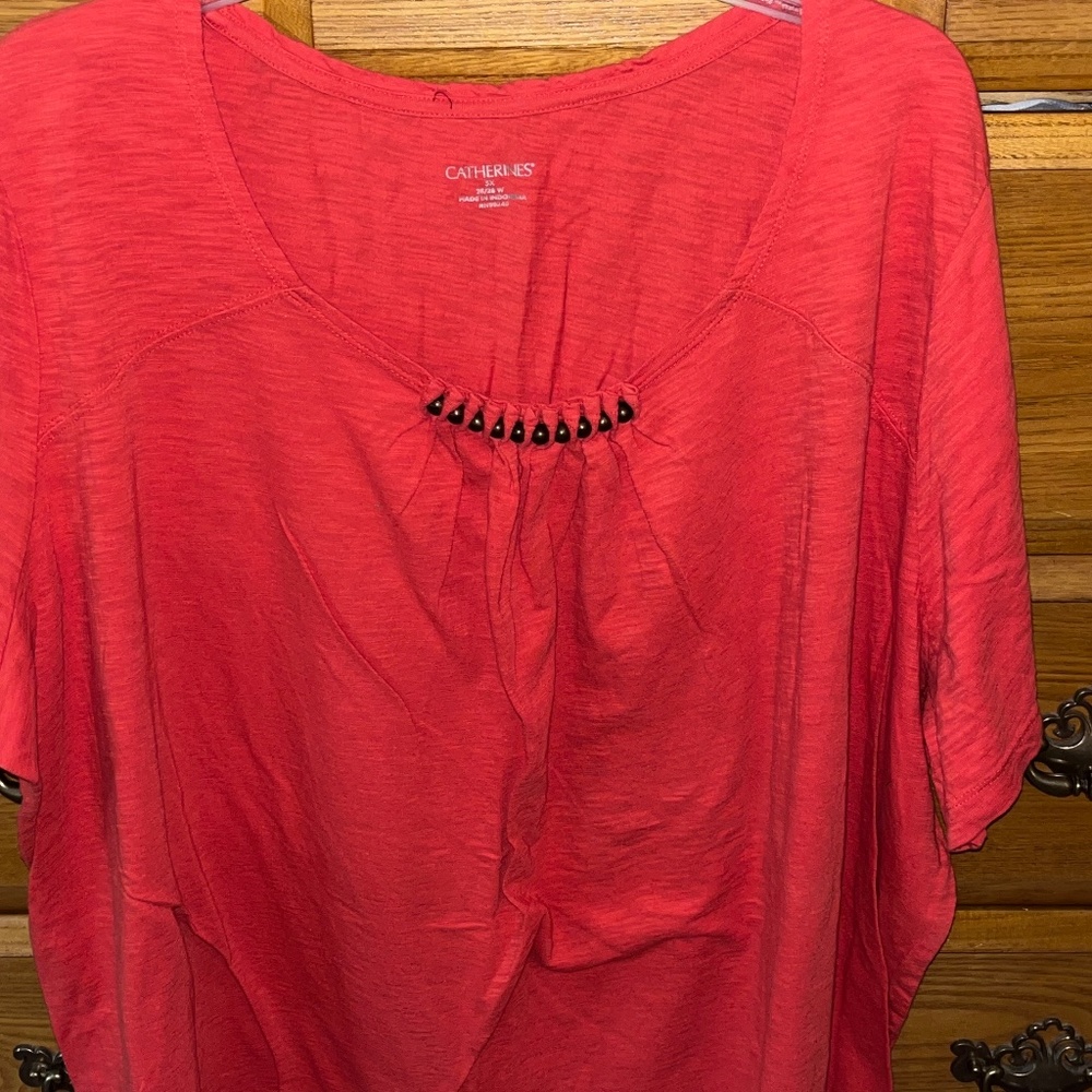 Catherine‘s plus size tangerine orange T-shirt with brown beaded detail